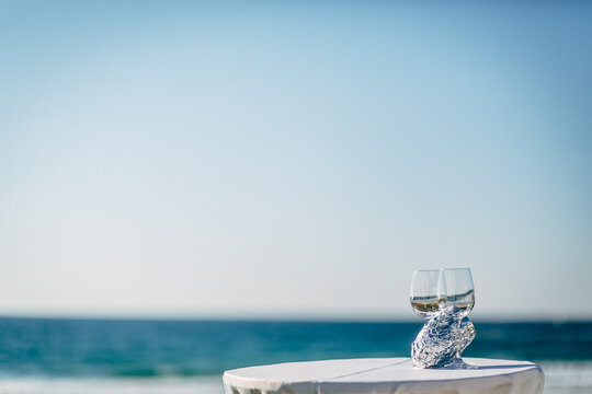 View Of Drinks On Table Against Sea