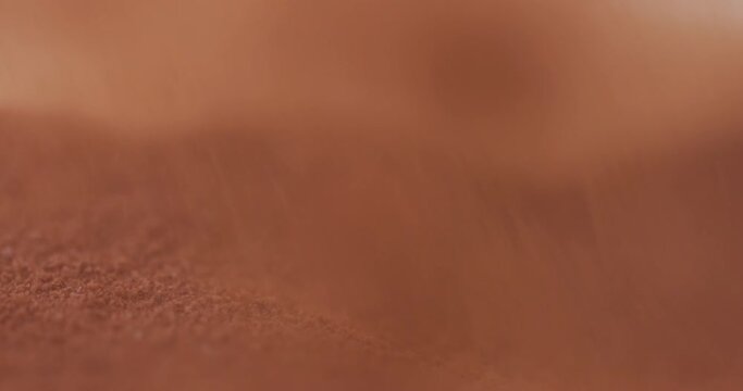 Powder flowing as sand like object closeup 