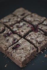 Tasty vegetarian brownie made from chocolate and cacao. Delicious chocolate pie. Selective focus....