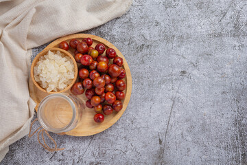 Pickled Plums on the dark background.