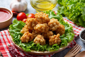 shrimp balls covered with breaded fried on the dark background.