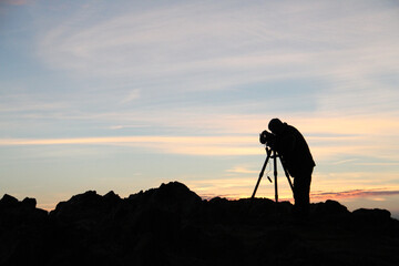 silhouette of photographer at sunrise