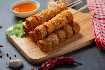 Deep fried fhicken roll on the dark background.