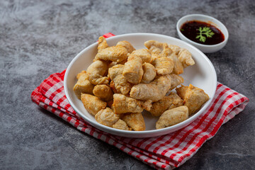 Deep fried fish ball on the dark background.
