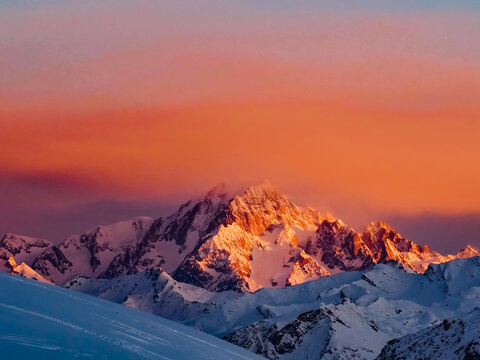 Scenic View Of Snowcapped Mountains Against Sky During Sunrise