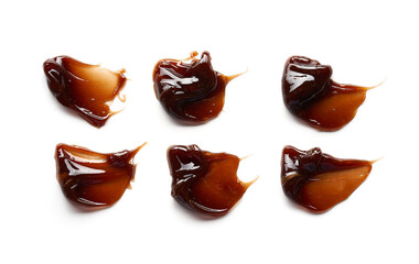 Chocolate colored gel smear and texture. Cosmetic gel or caramel syrup on white background