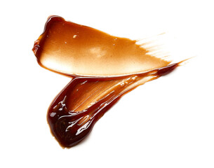 Chocolate colored gel smear and texture. Cosmetic gel or caramel syrup on white background