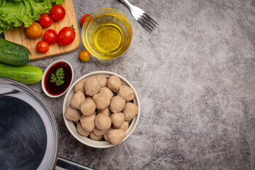 Beef ball fried on the dark wooden background.
