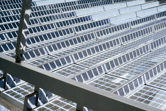 Detail View On Metal And Glass Roof Construction With Solar Panels