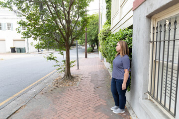 Fototapeta na wymiar a single woman in her 40's outside in Savannah, Georgia in the spring