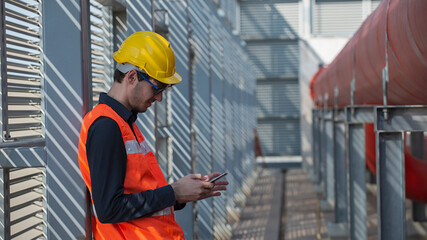 Construction technology concept. engineer. Industrial technology. worker using phone in plant in industrial.