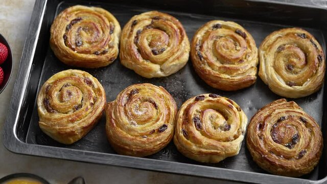 Freshly baked buns with cinnamon and spices. Close-up. Sweet baking concept