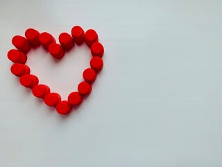 Red heart on a white background. Copy space.