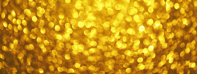 Abstract festive elegant background, banner of blurred with bokeh lights on golden background, defocused