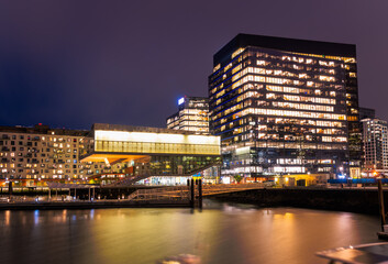 Night view of modren waterfront apartment and office buildings. Boston, MA, USA.