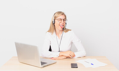 blonde pretty woman young blonde woman with cheerful and rebellious attitude, joking and sticking...