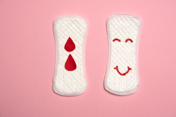 Happy face on woman's panty menstrual pad, isolated on pink.  