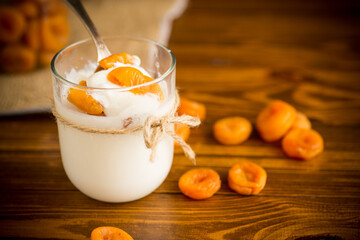 homemade sweet yogurt in a glass with dried apricots