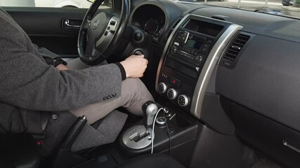 man parking car change position of gearbox shift stick
