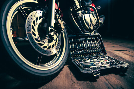 Tool box next to motorcycle in garage