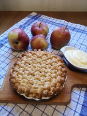 Homemade apple pie with vanilla sauce.