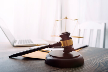 Business and lawyers discussing contract papers with brass scale on desk in office. Law, legal...
