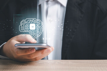 Artificial intelligence of futuristic technology concept. Businessman hand hold smartphone screen virtual circuit AI brain genius technology.
