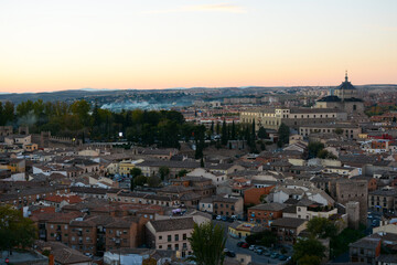 Fototapeta na wymiar Toledo, Spain - October 29, 2020: View to the old town from the observation deck during sunset