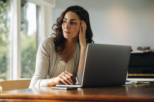 Stressed woman taking break from work at home
