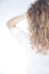curls hair of blond girl after hairdresser