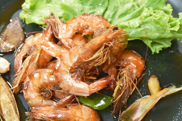 fried sweet shrimp with herb and lettuce arranging on plate