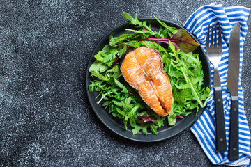 salmon and salad leaves green fish seafood snack pescetarian diet meal copy space food background rustic. top view 