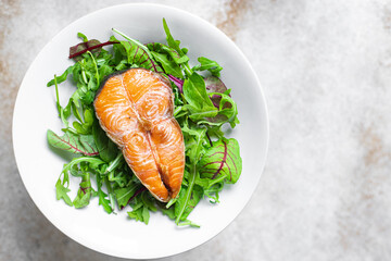 salmon and salad leaves green fish seafood snack pescetarian diet meal copy space food background rustic. top view 
