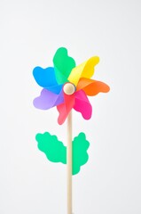 Colorful small windmill on a white background
