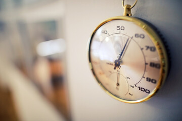 Shallow depth of field (selective focus) details with an analog hygrometer on the wall of a museum. - obrazy, fototapety, plakaty