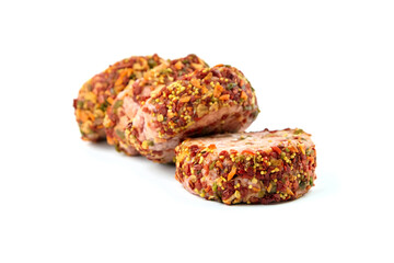 Raw meat patties with spices, four pork cutlets isolated on white