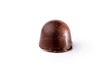 Homemade chocolate truffle on white background.