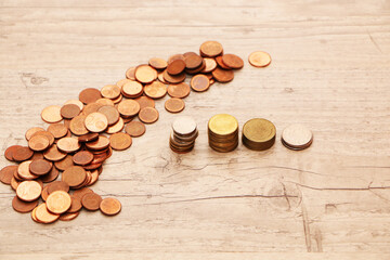 Money is scattered on the desk in the office and arranged in columns.