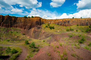 limestone cliffs from the old volcano and green vegetation in the middle of the plain - 434335159