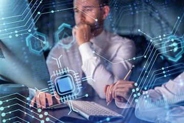 Two colleagues in formal wear working together to optimize business process by applying new technologies. Hi tech holograms over modern office background with panoramic windows