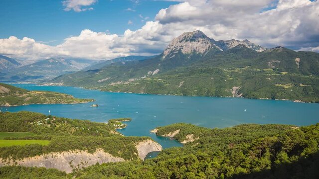 Serre-Poncon lake and the Saint-Michel bay with Grand Morgon peak in Summer (timelapse). The Pic de Morgon is located in Erins National Park, Hautes-Alpes, Southern French Alps, France
