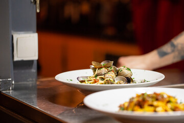 two plates of italian food ready for serving 
