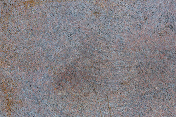 Red and blue rough brushed granite wall background. Aged granite stone slab texture. Abstract weathered stone backdrop.