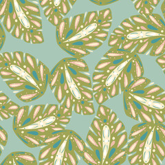 Random green folk monstera print seamless pattern. Blue background. Bloom tropic foliage ornament.