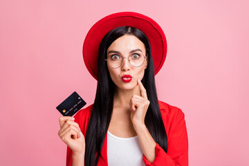 Naklejka premium Photo of young girl happy positive smile hold credit card pouted lips send air kiss isolated over pink color background