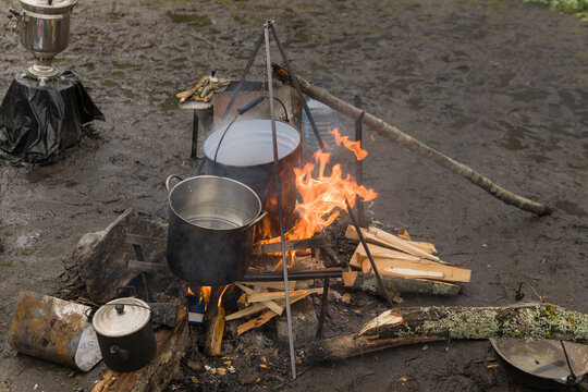 Cauldrons Over A Campfire