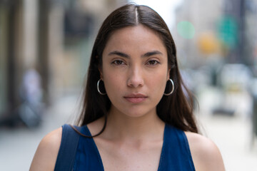 Young Latina Hispanic woman serious face portrait
