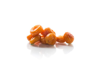 delicious dried apricots in a bowl on white background