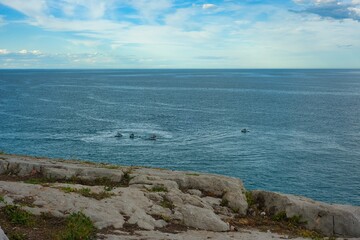 View from the Castle of Peñíscola of the Mediterranean Sea. Nautical sports. Jet skis drawing wakes in the sea