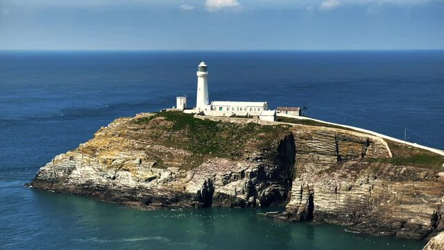 The pretty lighthouse off the coast of Anglesea in North Wales